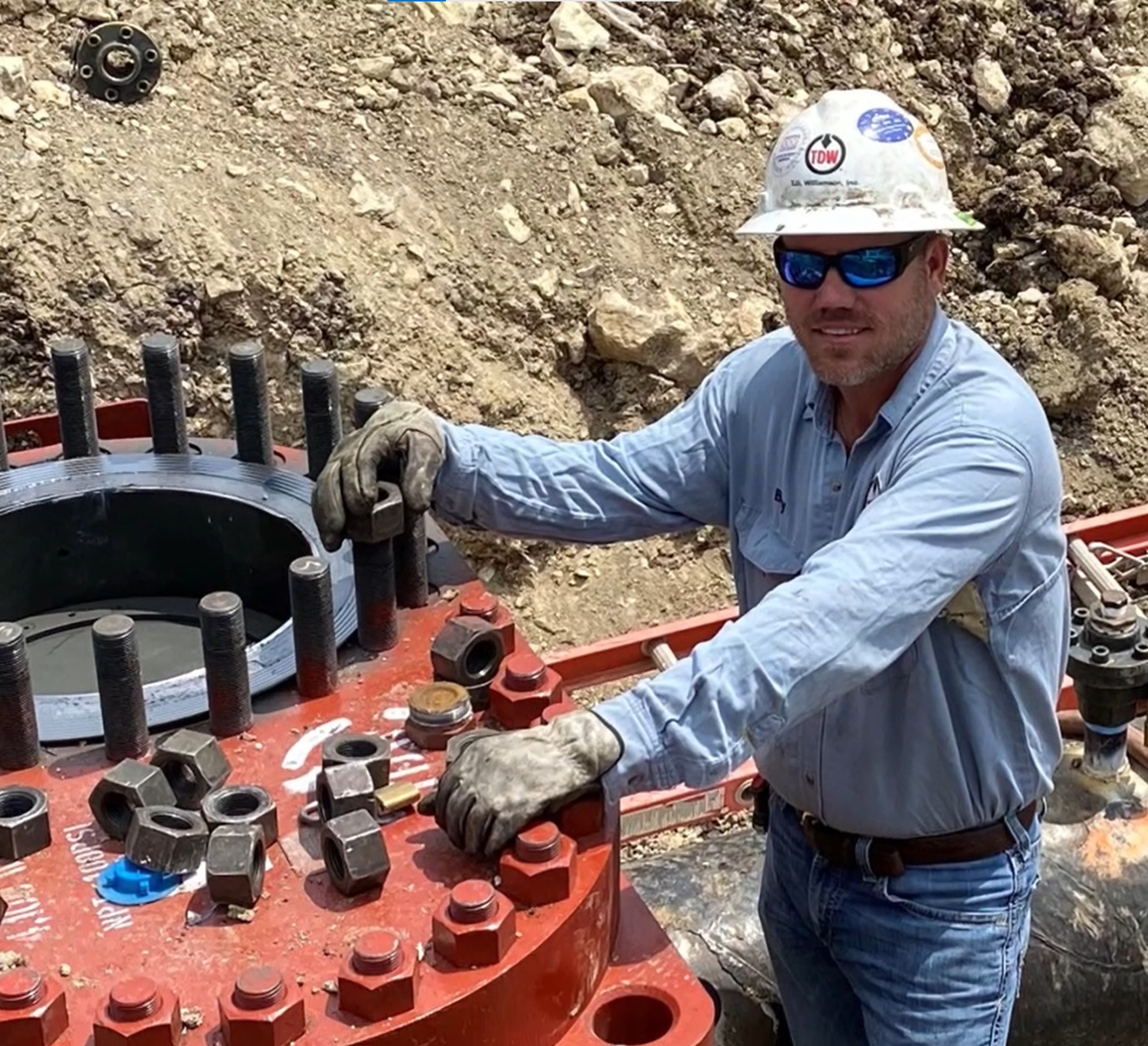 Field Services technician working in a trench Field Services technician working in a trench